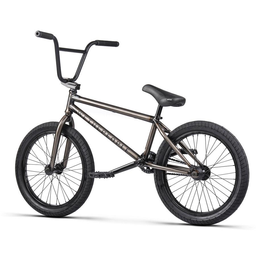 Introducing the Wethepeople Justice 20 Inch Bike in sleek black, featuring a robust frame, straight handlebars, and thick, knobby tires designed for stunts and tricks. Equipped with top-of-the-line BMX components, this urban bike is built to handle anything the streets throw at it.
