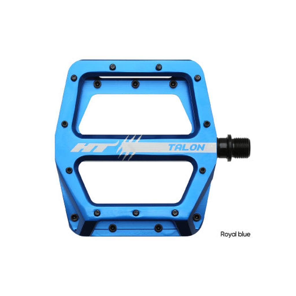 The HT AN71 Talon Pedals feature a blue flat platform design, visible grip pins, and a metal spindle on the right side.