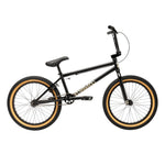A Fit Bike Co Series One Bike with a Cro-Mo frame, black finish, tan-walled tires, black seat, and handlebars is displayed in side view on a white background.