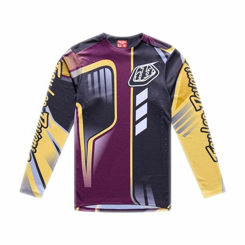 TLD 26.1 Sprint Pro Jersey / Lowrider Sangria: Long-sleeve, race-fit cycling jersey featuring geometric maroon, black, yellow, and gray patterns with stylized logos/text on chest and sleeves, plus moisture-wicking fabric for comfort.