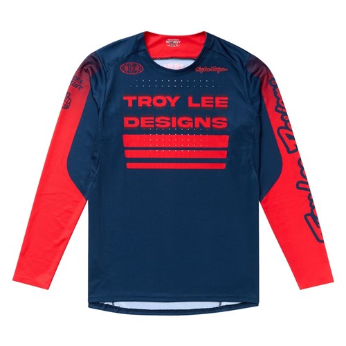The TLD 25.2 Sprint Jersey / Segment Midnight features a navy blue base with bold red sleeves and "Troy Lee Designs" branding in striking red—delivering race-ready performance and style.