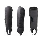 The Fuse Alpha Plus Shin/Ankle Combo Pads (Pair) are shown from different angles, featuring black padded design with straps and reinforced areas for optimal leg protection against a white background.