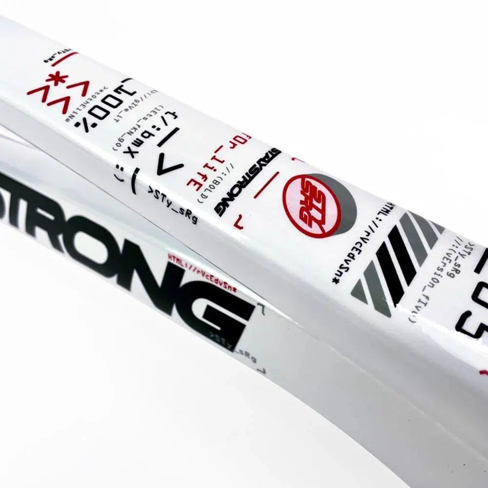 Close-up of a white metal item with black and red text and symbols, accompanied by Japanese characters. This intricately designed piece reflects the high craftsmanship of Staystrong V5 Disc Pro Cruiser Frame and showcases the robustness typical of an aluminium race frame.