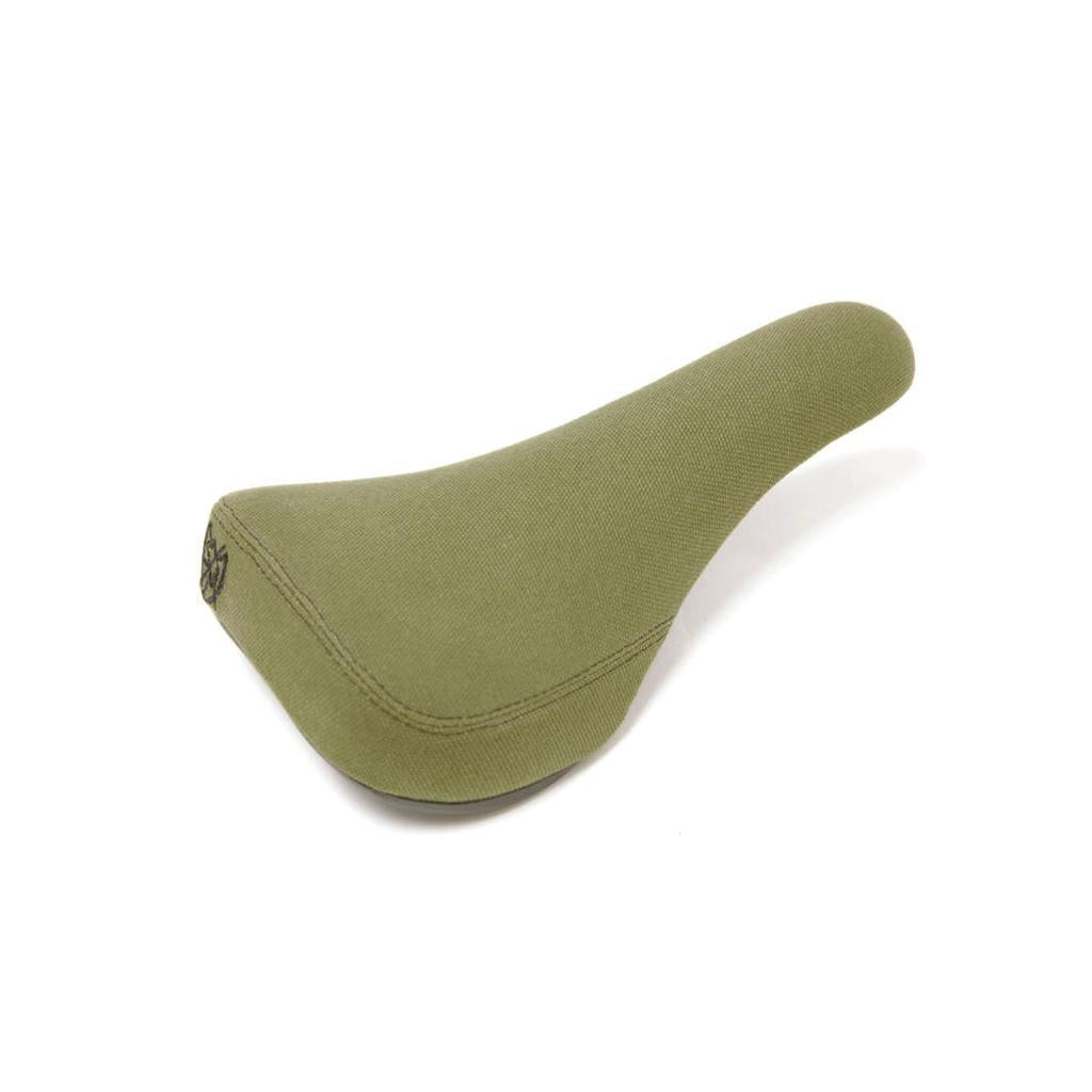 The S&M Stealth Pivotal Seat (Canvas) features an olive green textured fabric surface for comfortable pedalling, displayed against a plain white background.