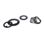 The Eclat Shift/WTP Hybrid Slack Disc Set, featuring black plastic rings, a metal cylinder, and rubber gaskets—perfect for Eclat Shift or WTP Hybrid hub setups—is arranged on a white background.
