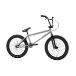 The Sunday Blueprint 20 inch Bike is a silver beginner BMX with black handlebars, tires, and seat, shown from the side on a white background—featuring reliable Odyssey Parts for enhanced performance.