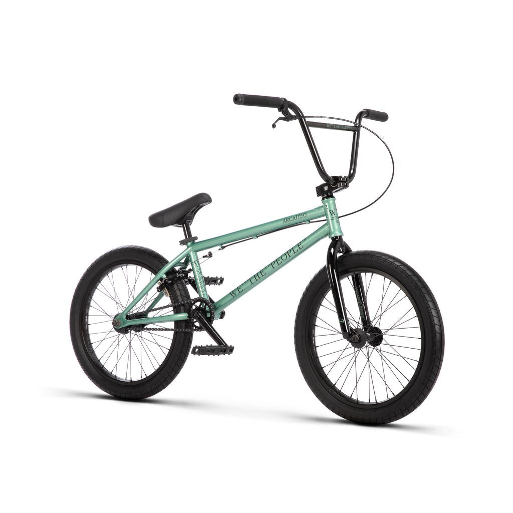 Mint green Wethepeople Arcade 20 Inch Bike with black handlebars, fork, Salt Valon rims, and seat.
