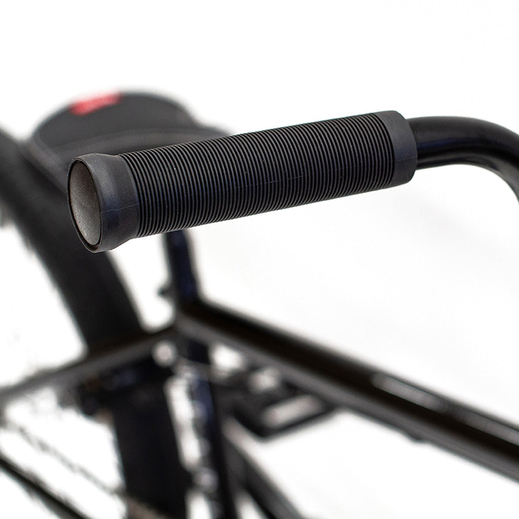 A close up of a black Division Reark 20 Inch Bike handlebar.