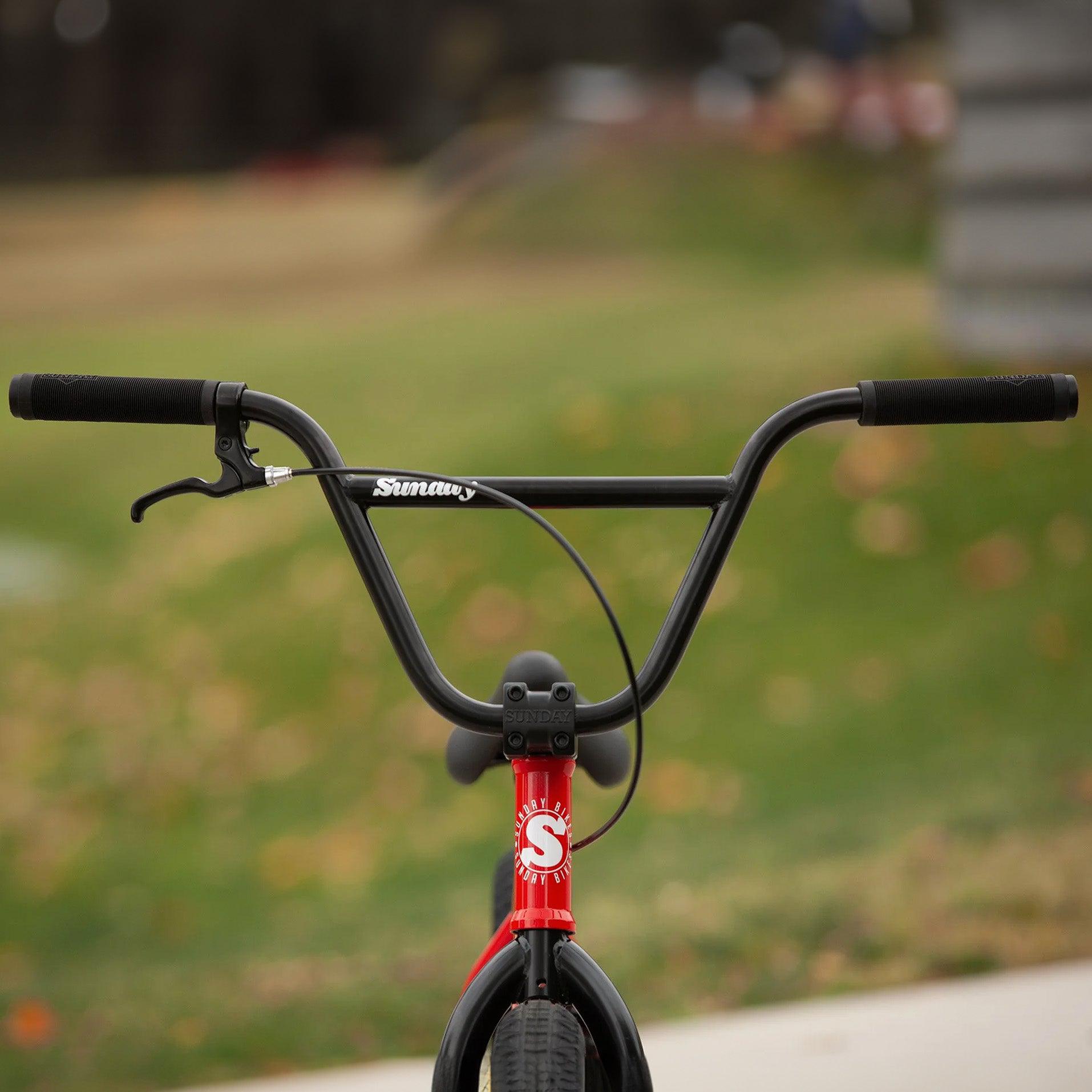 A Sunday Blueprint 20 inch bike with a black handlebar.