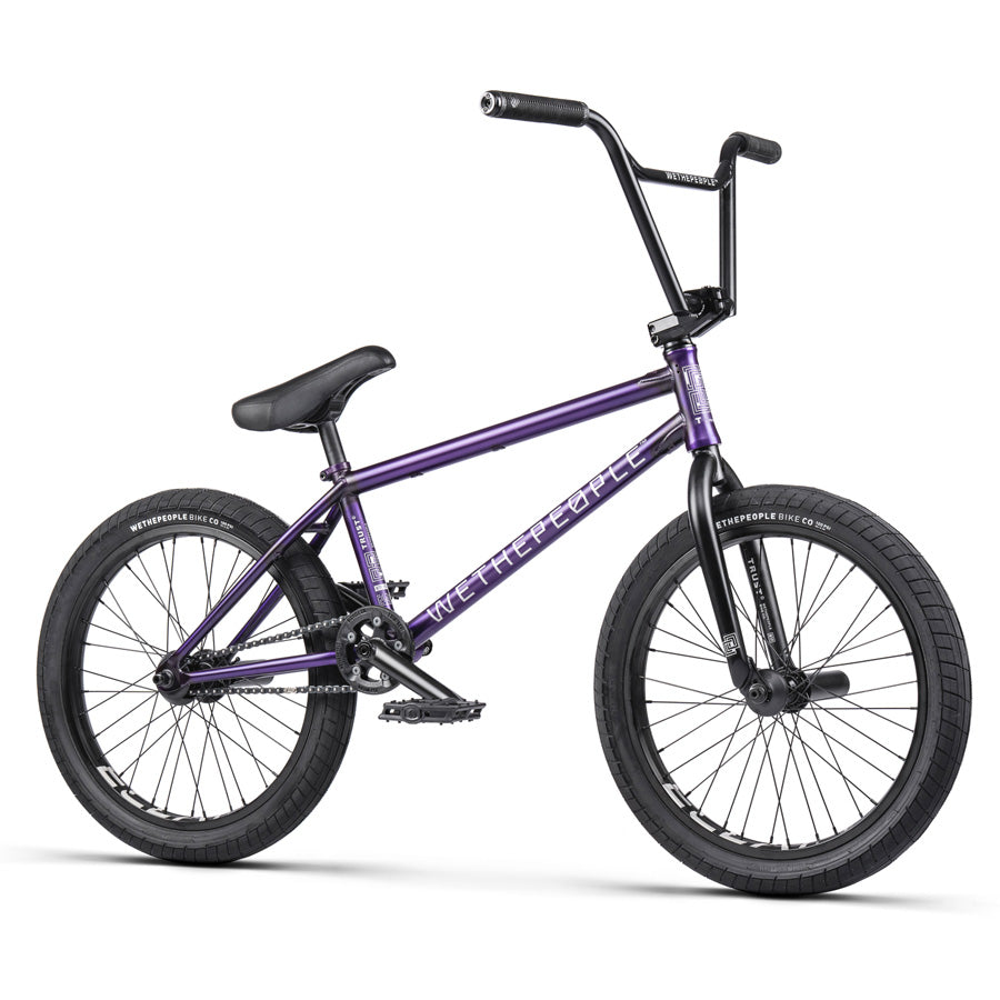 A purple Wethepeople Trust 20 Inch Freecoaster Bike on a white background.
