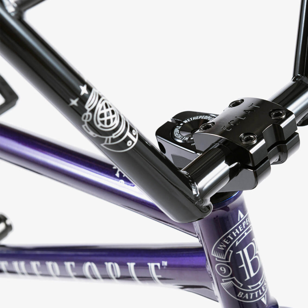 A purple Wethepeople Battleship 20 Inch BMX bike with a black handlebar, hydroformed gussets, and a 4130 Chromoly frame.
