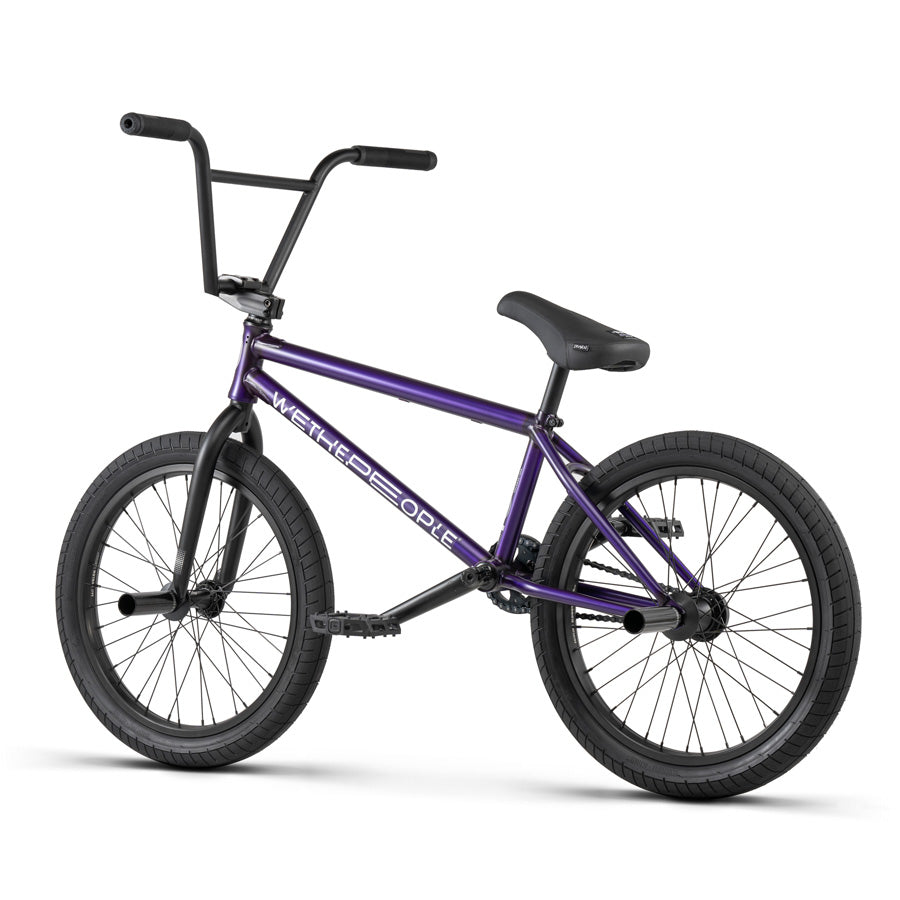 A purple Wethepeople Reason 20 Inch BMX Bike, perfect for urban warriors, set against a white background.