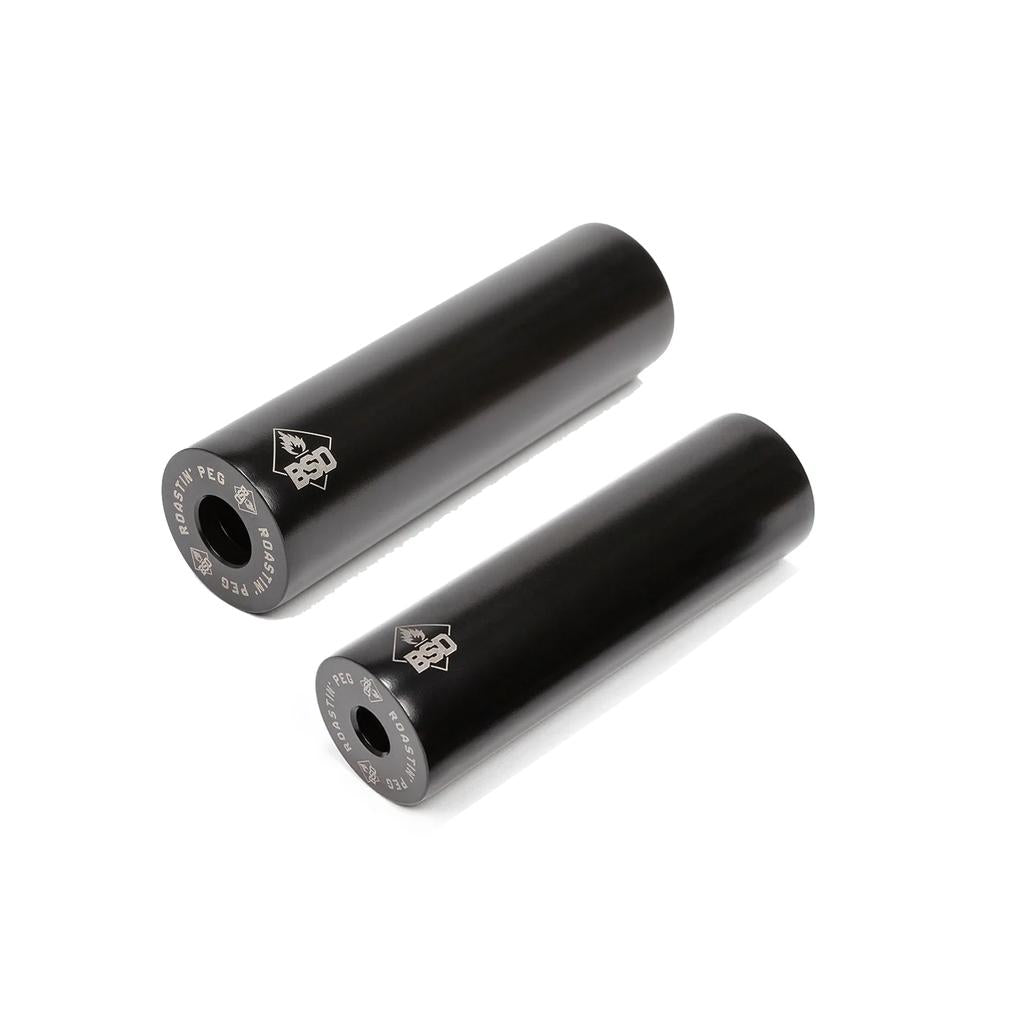 A pair of black BSD Roastin Pegs (each), made from durable 4140 chromoly, are displayed on a white background with visible logo and text—ideal BMX grind pegs for smooth, long-lasting performance.