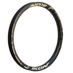 An Ikon Carbon 20 Inch Brakeless Rim with gold lettering on it.