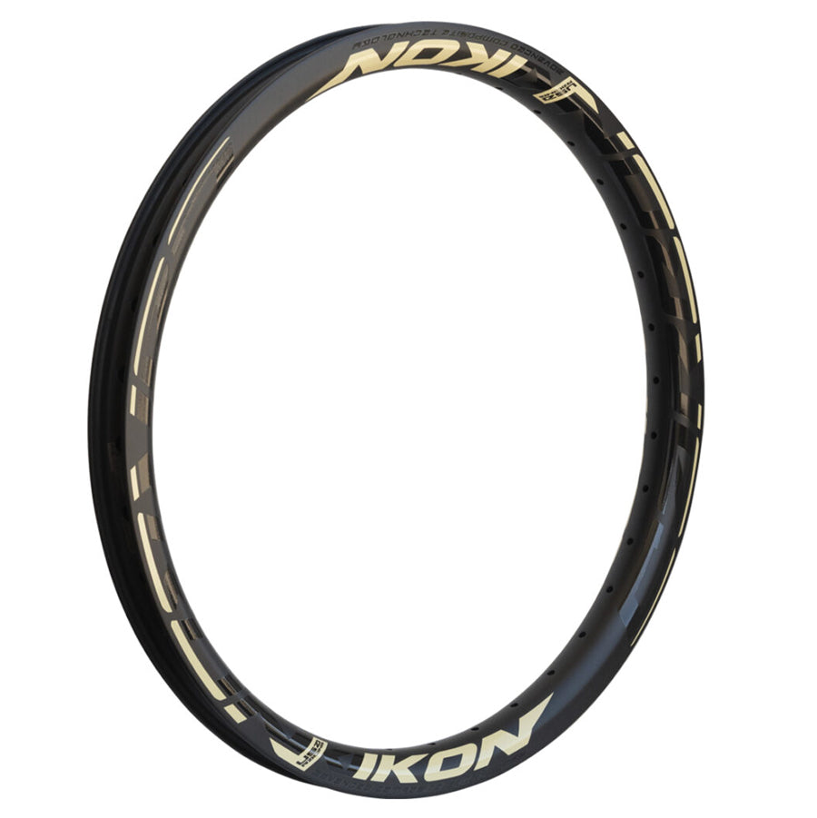 An Ikon Carbon 20 Inch Brakeless Rim with gold lettering on it.