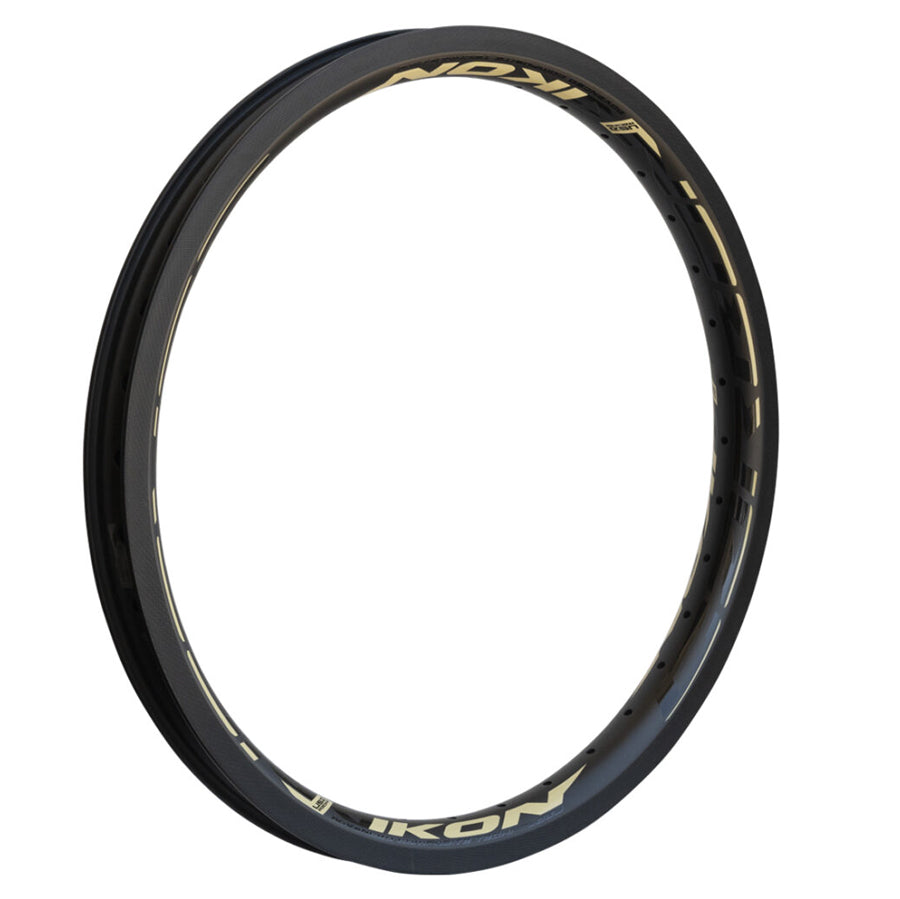 A black Ikon Carbon 20 Inch Brake Rim with gold lettering on it.