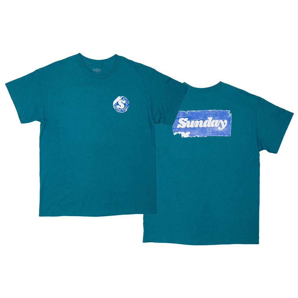 The Sunday Sticker T-Shirt is a teal short-sleeve tee with a small circular Sunday Sticker logo on the chest and a large white "Sundays" graphic in a blue rectangle on the back.