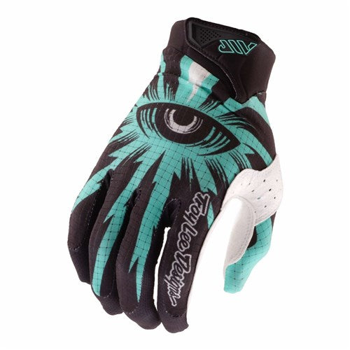 The TLD 26.1 Air Glove / Cyclops Carbon is a black and teal mountain bike glove with an eye graphic on the back, "Troy Lee Designs" on the index finger, and a touchscreen-compatible single layer palm.