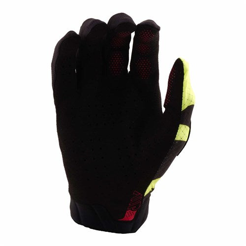 The TLD 26.1 Air Gloves (Youth) in Cyclops Black/Flo Yellow feature an ergonomic fit, designed for mountain bike riders with red and yellow accents, shown palm out and fingers slightly bent.