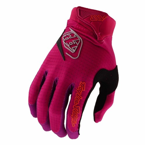 The TLD 26.1 Air Gloves (Youth) in Mono Light Fuchsia are full-finger mountain bike gloves with black and orange accents, featuring the Troy Lee Designs logo and a touchscreen compatible ergonomic fit for convenient rides.