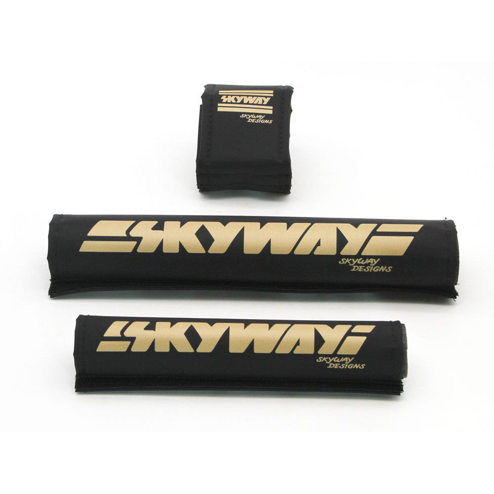 A set of black and gold SKYWAY USA Made Retro Pad Set logos on a white background featuring Velcro closures.