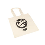 The BSD Acid Tote Bag is made from sturdy natural cotton, featuring two handles and a black distressed face graphic with "BSD" text below.