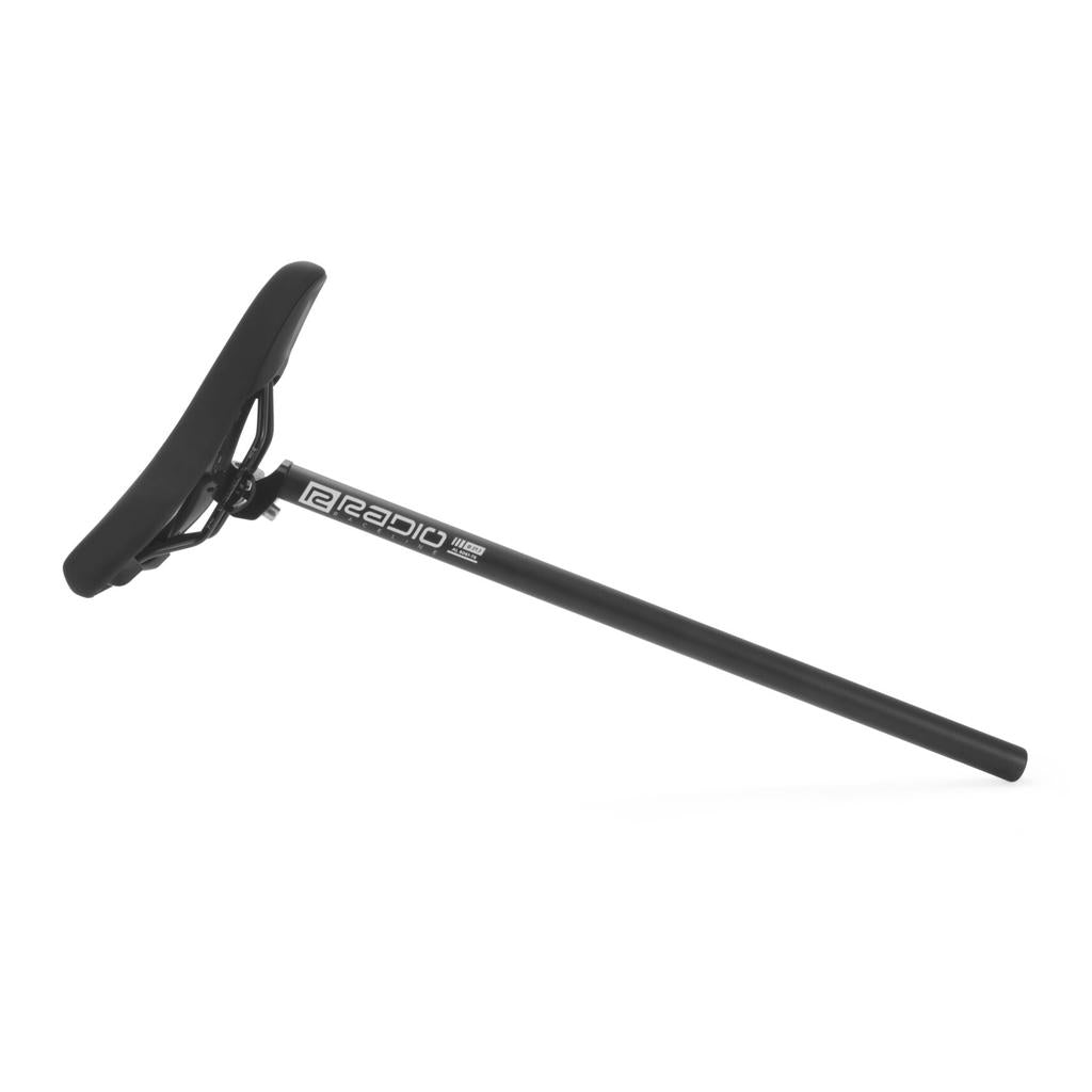 The Radio Raceline Seat and Post Set includes a black padded bike seat with a long, straight CNC machined alloy post featuring the "Radio" logo, displayed against a white background.