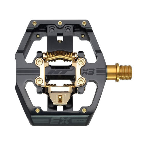 Limited Edition Gold HT Components X3Ti mountain bike pedal with open hexagonal platform and central clipless mechanism, viewed from above—a true Downhill World Cup pedal.