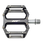 HT Components AR09SX Mini Pedals: black platform pedals with a metal axle and ultra-grippy pins, shown from above on a white background—ideal for kids' BMX bikes.