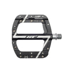 The HT Components Leap ANS08 Pedals are black and silver flat mountain bike pedals marked "LEAP" and "HT," with metal pins, a durable axle, and a reliable EVO+ bearing system.