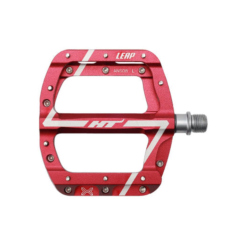 The HT Components Leap ANS08 Pedals feature a red aluminum wide platform, silver pins for grip, white graphics, and a visible right-side axle—perfect mountain bike pedals.