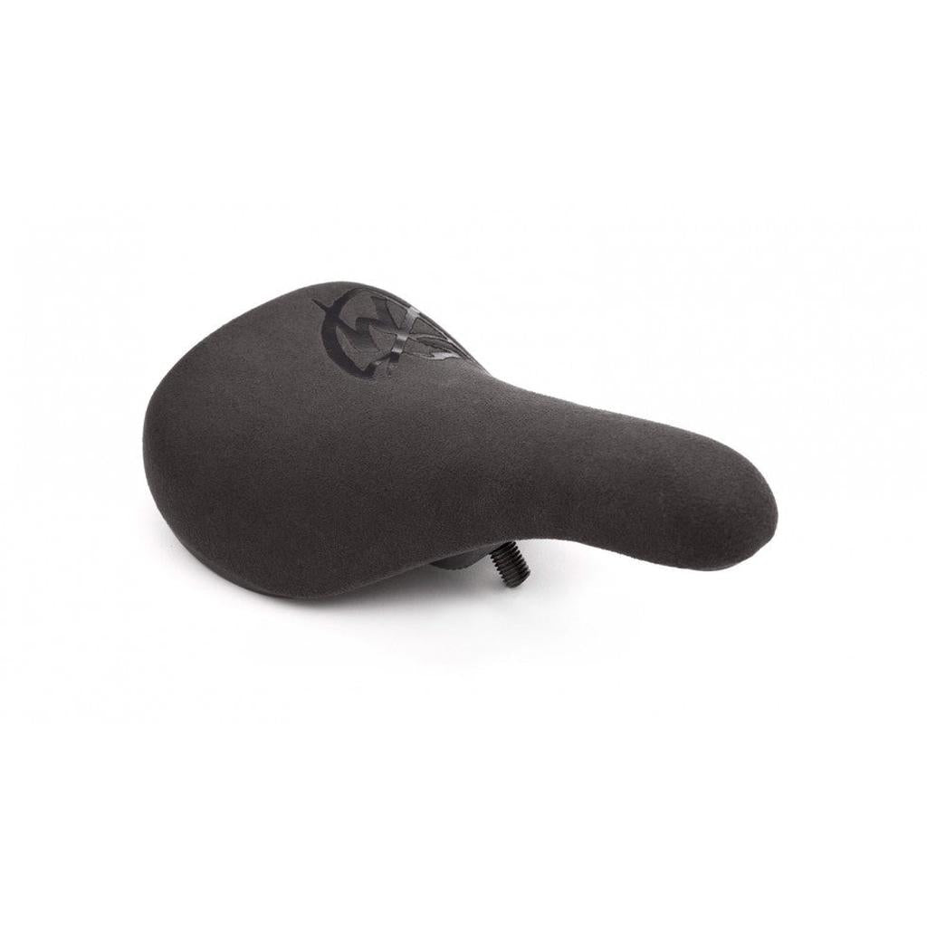 S&M Stealth Slim Pivotal Seat—black ergonomic bike saddle with textured microfiber surface and bolt underneath, displayed on a white background.