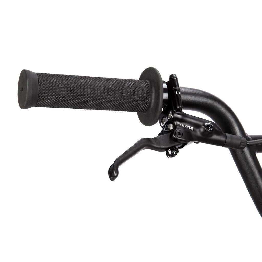 Close-up of the Radio Xenon Expert Disc 20 Inch Bike's black handlebar, featuring a textured rubber grip and an attached brake lever, part of this BMX race bike designed with a lightweight alloy frame and sealed cassette drivetrain.