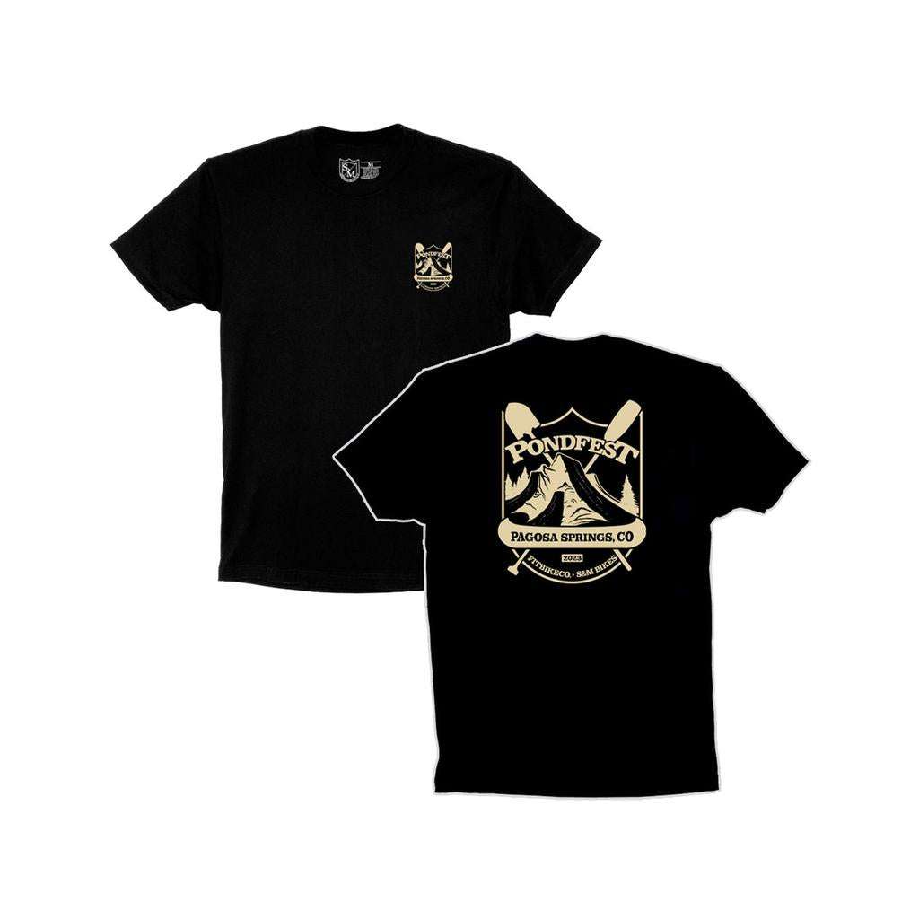 The S&M Pondfest Shield T-Shirt features a small "Pondfest" logo on the front left chest and a large "Pondfest Pagosa Springs, CO" graphic with mountains and paddles on the back. Printed in the USA—great for BMX fans and festival lovers.
