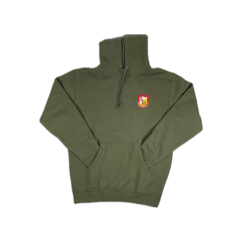 The S&M Shield Pullover Hoodie is an olive green premium heavyweight hoodie featuring a fleece lined hood, front pocket, and a red and yellow crest logo on the left chest.