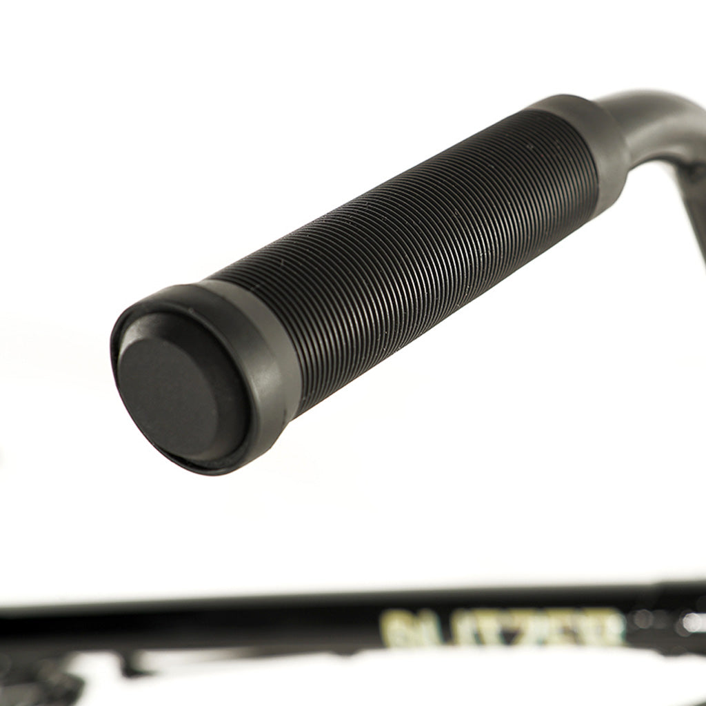 A close up of a Division Blitzer 20in Bike handlebar on a BMX bike.