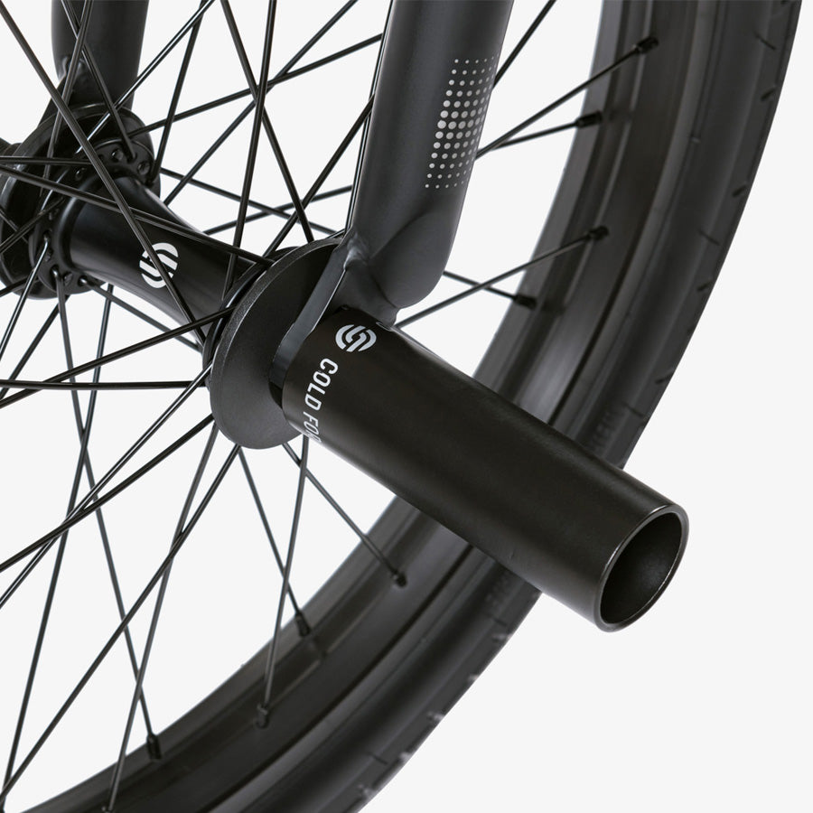 A close up of a black Wethepeople Reason 20 Inch BMX bike wheel.