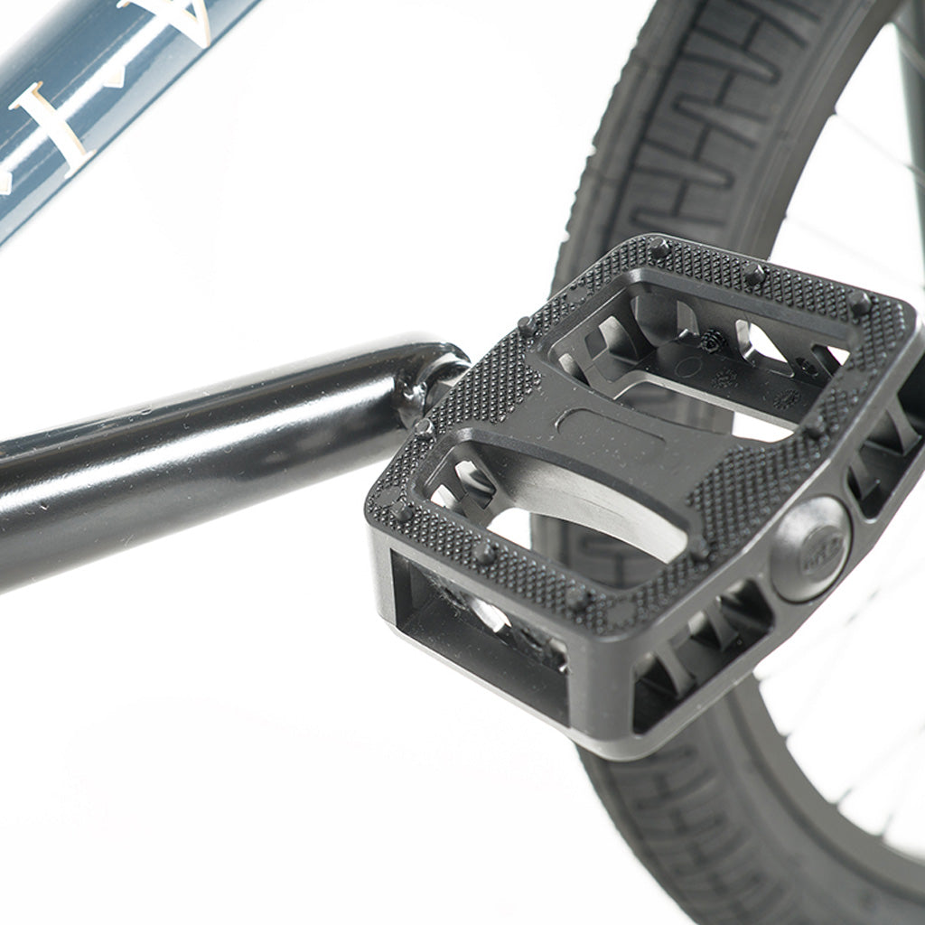 A close up of the pedals on a Division Reark 20 Inch Bike.