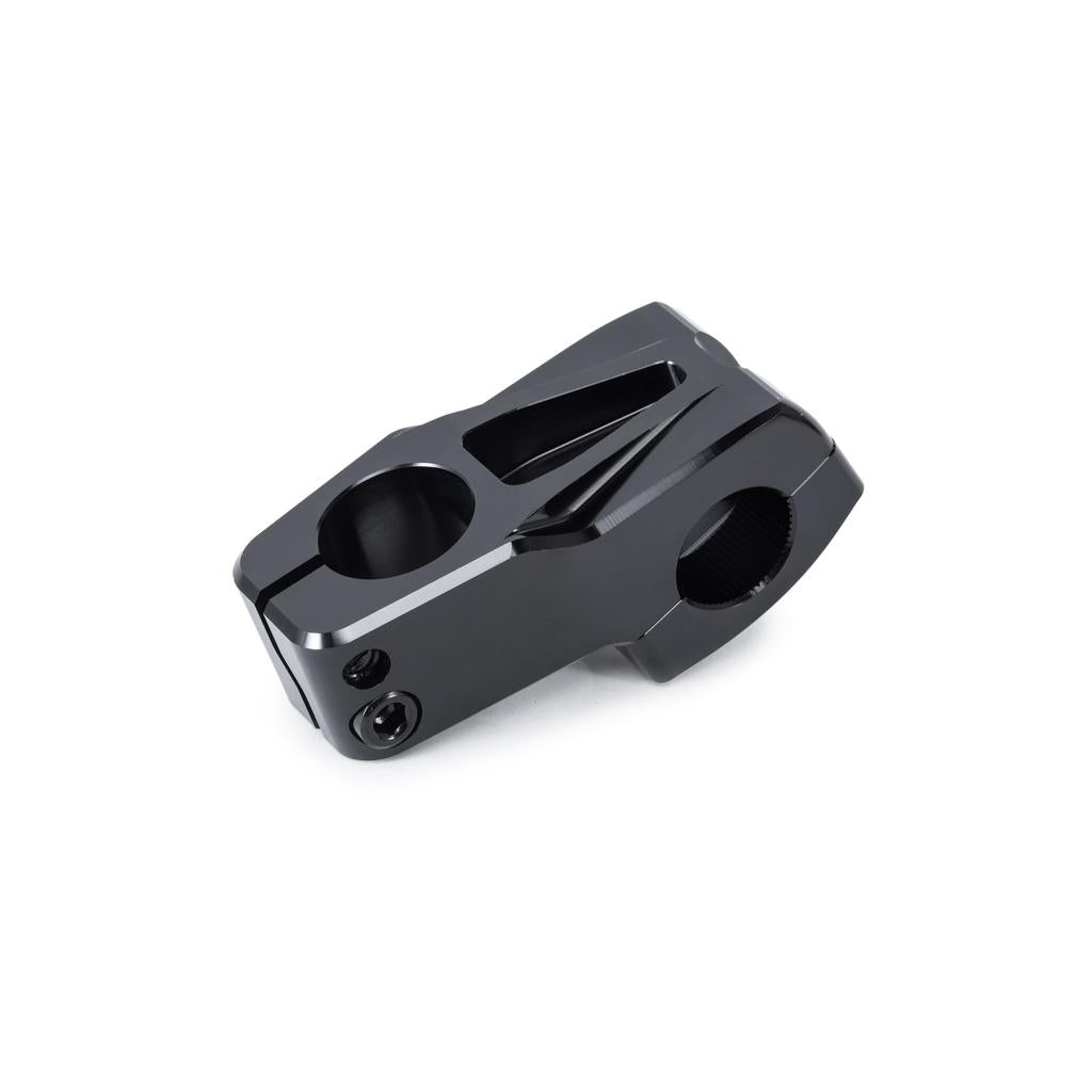 The Wethepeople Hydra Stem (25.4mm Clamp) is a black metal stem with a sleek, angular design, featuring Shark Tooth Clamping and dual clamp openings for secure handlebar and fork steerer tube connection.
