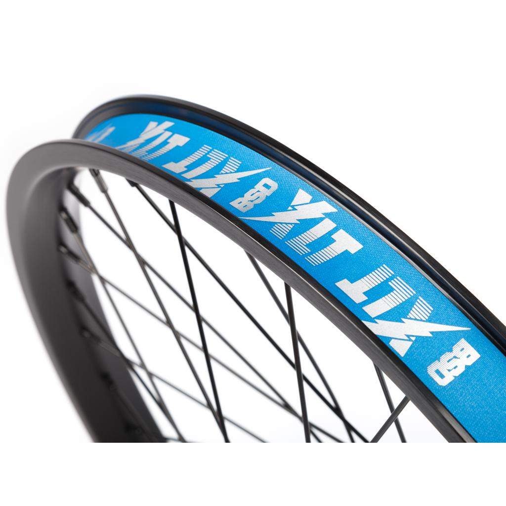 Close-up of the BSD XLT x Revolution V1.5 Rear Wheel: black rim, black spokes, blue rim strip with white graphics, and the BSD Revolution v1.5 hub with advanced Planetary Clutch Mechanism.