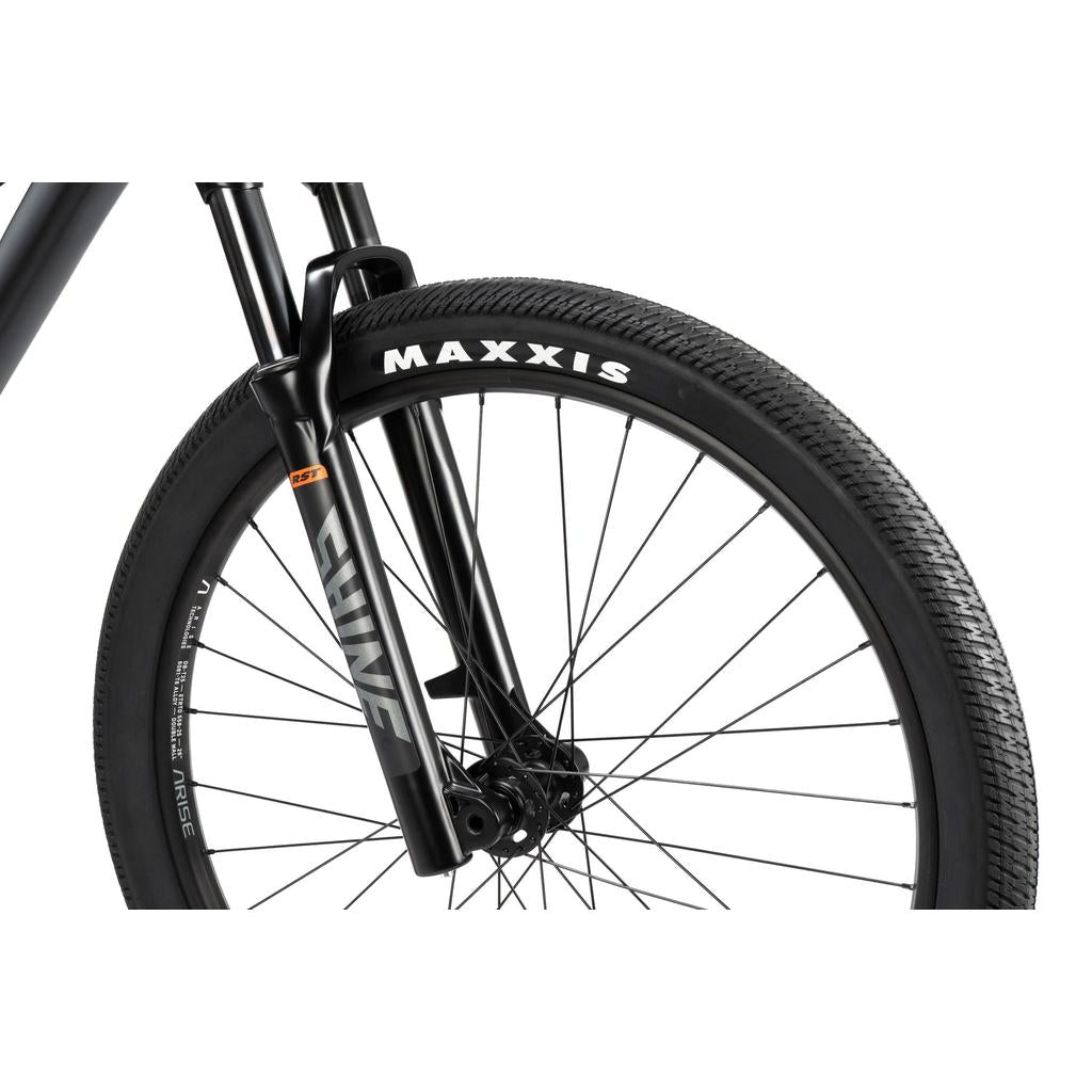 Close-up of the Radio 26 Inch Griffin Pro Bike's black front wheel with Maxxis tire, black spokes, and "LINE" labeled black fork, all on a sturdy alloy frame.
