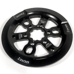 The PROFILE Signet Universal Sprocket W/ guard is a black metal BMX sprocket with "SIGNET" and "PROFILE RACING" branding, multiple cutouts, and a universal guard for broad crank compatibility.