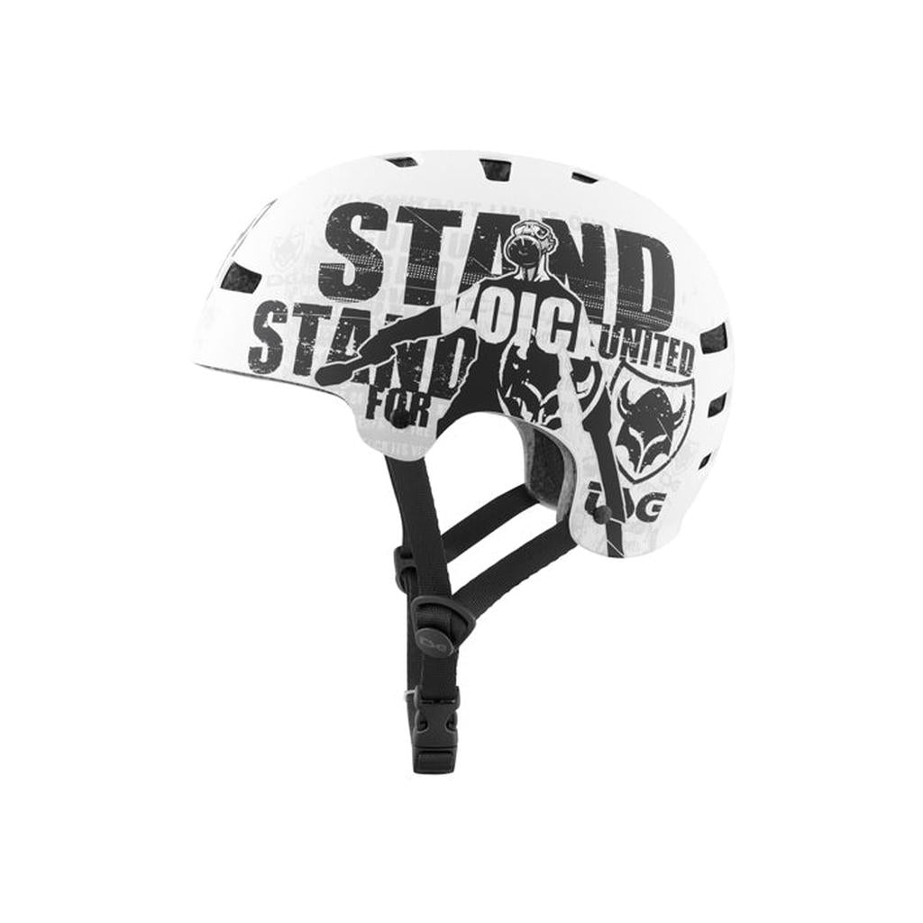 The TSG Evolution Helmet / Goldbeck Protest is a slim, high-impact hardshell helmet in white with black straps, bold "STAND UNITED" text, and stylized graphics of a person and wolf for standout safety and style.