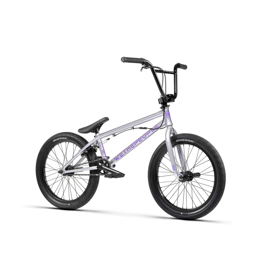 The Wethepeople Versus 20 Inch Bike is shown in silver with a durable Chromoly frame, black tires, handlebars, and seat against a white background.