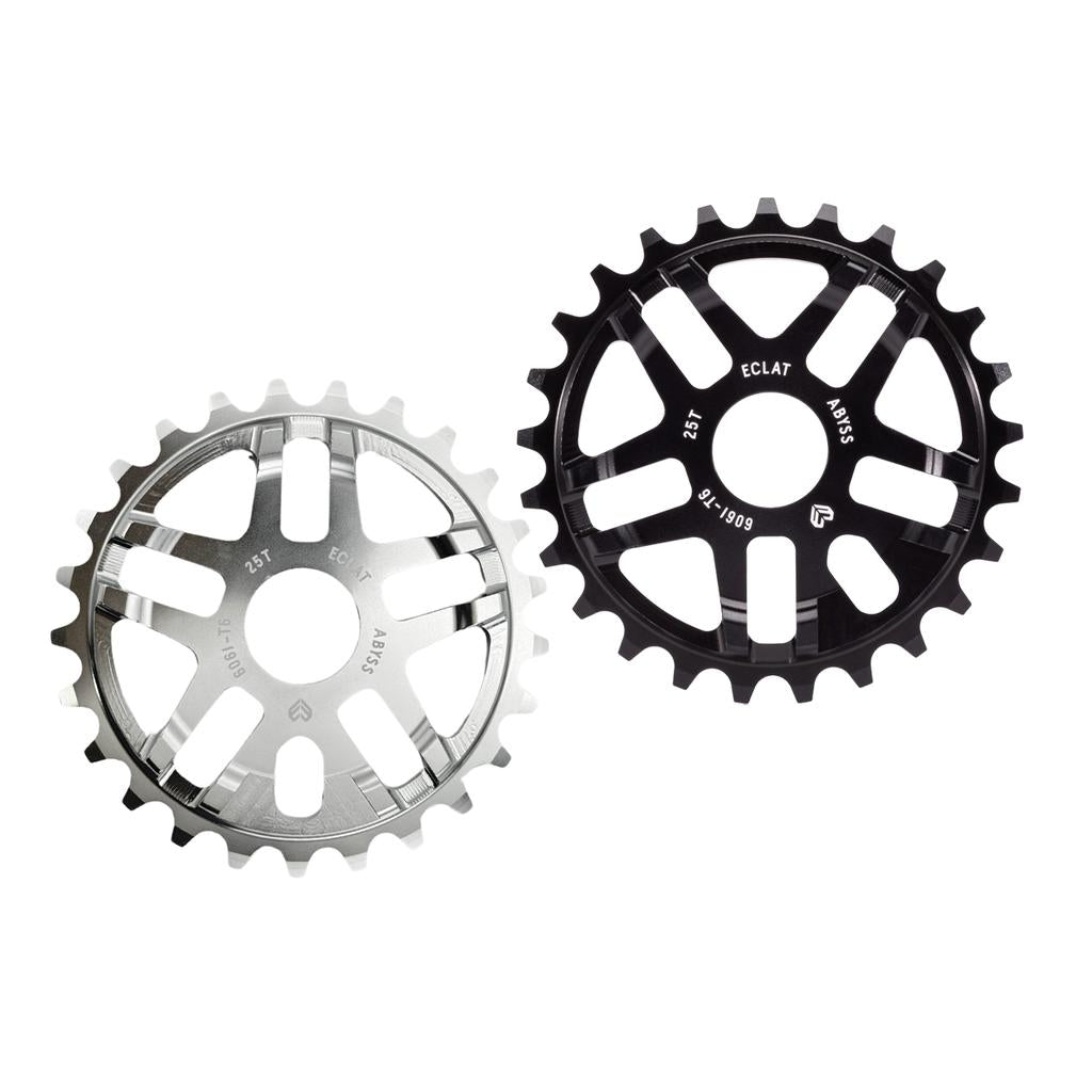 Two Eclat Abyss BMX sprockets made from 6061-T6 alloy, one silver and one black, each with 25 teeth and multiple cutouts, are displayed against a white background.