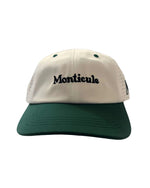 The Monticule Vapor Strap Back Hat features a green brim, white front panel, and "Monticule" embroidered in black. This two-tone cap is breathable and comfortable for stylish all-day wear.