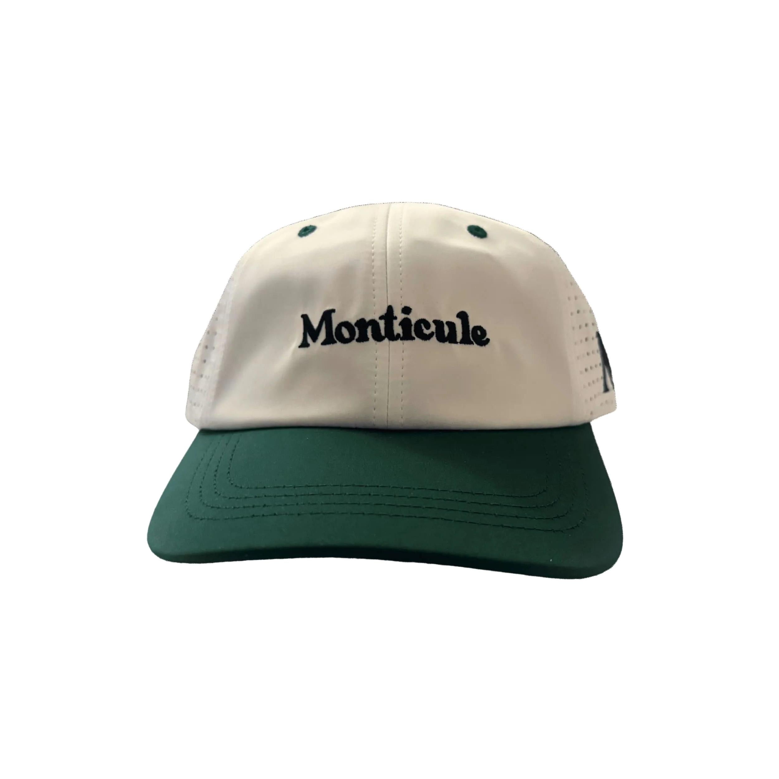 The Monticule Vapor Strap Back Hat features a green brim, white front panel, and "Monticule" embroidered in black. This two-tone cap is breathable and comfortable for stylish all-day wear.