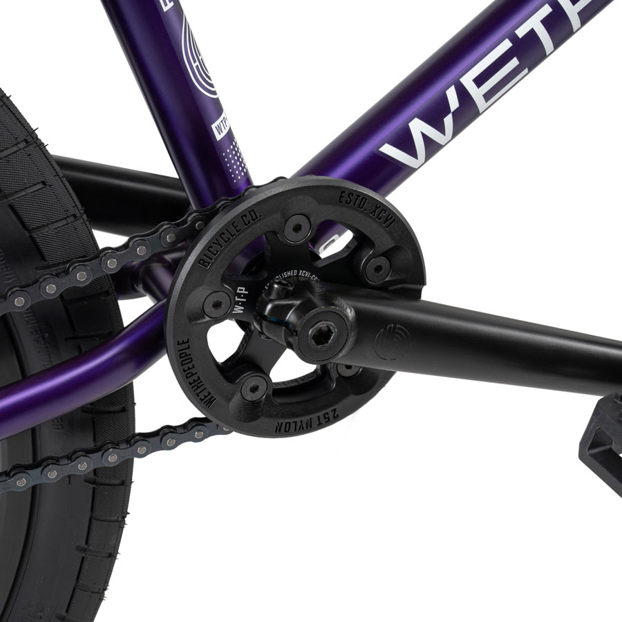 The urban warriors ride confidently on their Wethepeople Reason 20 Inch BMX Bike, complete with the sleek combination of a purple frame and a black chain.