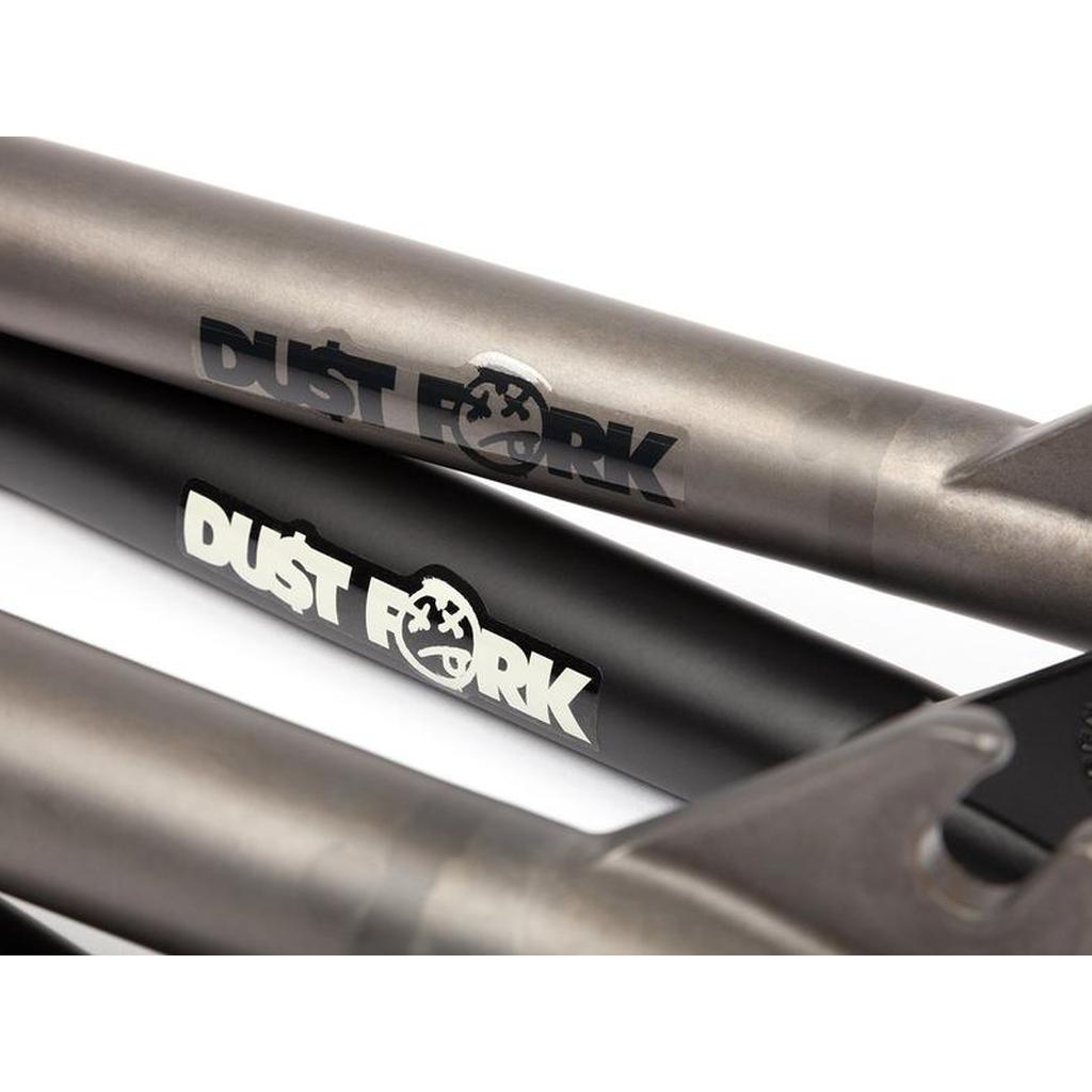 Close-up of three BSD Dust Fork BMX forks in matte black and metallic, each with a "DUST FORK" logo and 26mm offset.