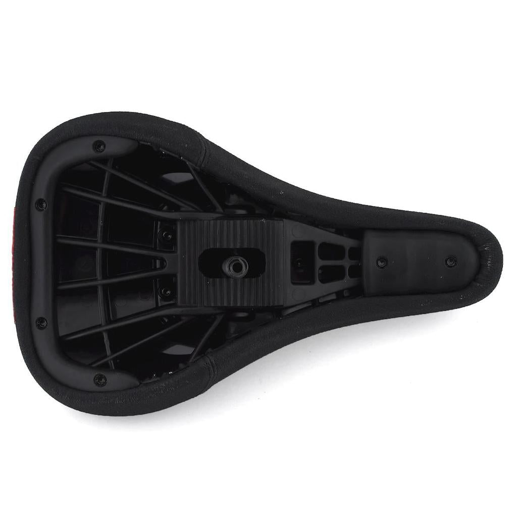 The underside of the Shadow Crow'd Pivotal Seat reveals its plastic support structure and mounting point beneath the black synthetic leather cover.